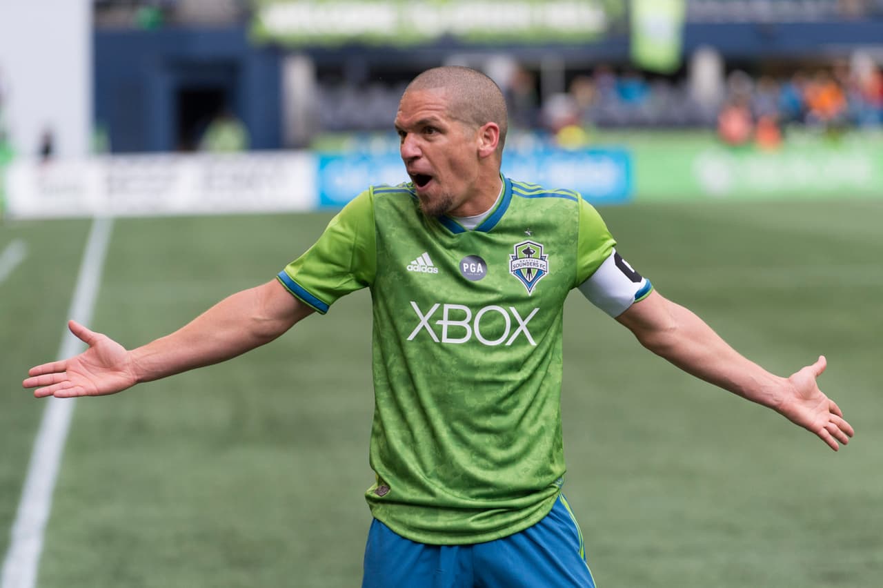 Oct 28, 2018; Seattle, WA, USA; Seattle Sounders midfielder Osvaldo Alonso (6) argues with the referee assistant during the second half at CenturyLink Field. Seattle defeated San Jose 2-1. Mandatory Credit: Steven Bisig-USA TODAY Sports