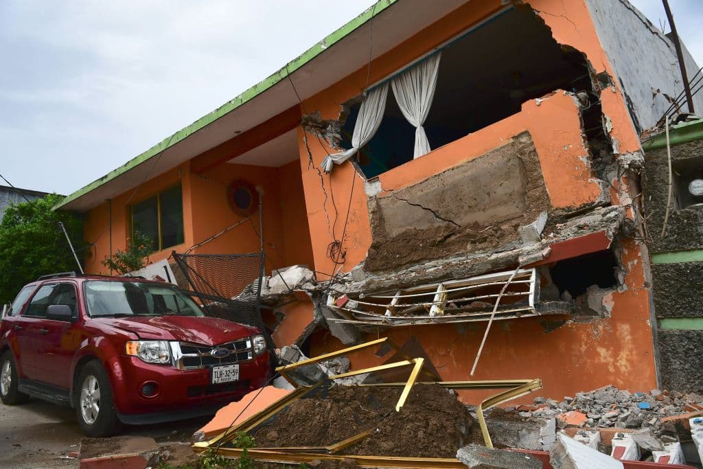 A house severely damaged by Thursday night's 8.2-magnitude quake, in Juchitan, Oaxaca, Mexico, on September 10, 2017. Rescuers pulled bodies from the rubble and grieving families carried coffins through the streets Saturday after Mexico's biggest earthquake in a century killed 65 people. / AFP PHOTO / RONALDO SCHEMIDT (Photo credit should read RONALDO SCHEMIDT/AFP/Getty Images)