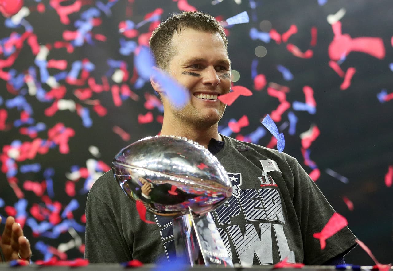 HOUSTON, TX - FEBRUARY 05: Tom Brady #12 of the New England Patriots holds the Vince Lombardi Trophy after defeating the Atlanta Falcons 34-28 in overtime during Super Bowl 51 at NRG Stadium on February 5, 2017 in Houston, Texas. (Photo by Tom Pennington/Getty Images)