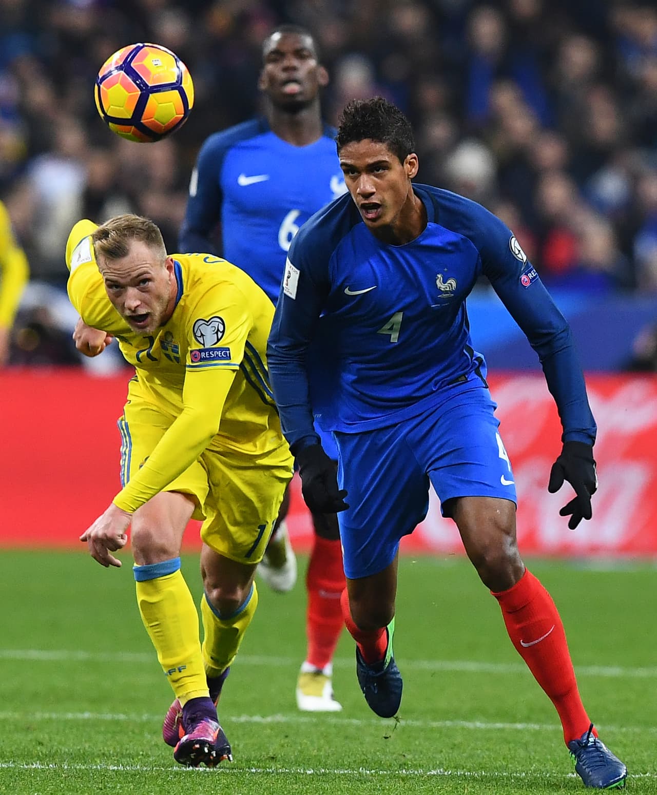 Sweden's forward John Guidetti (L) challenges France's defender Raphael Varane during the 2018 World Cup group A qualifying football match between France and Sweden at the Stade de France in Saint-Denis, north of Paris, on November 11, 2016. / AFP / FRANCK FIFE (Photo credit should read FRANCK FIFE/AFP/Getty Images)