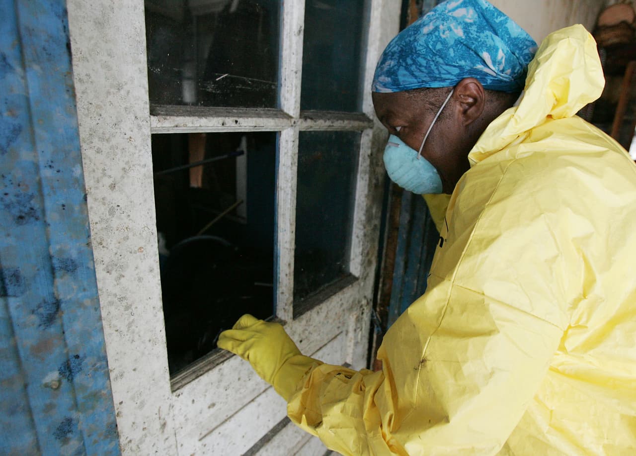 NEW ORLEANS - OCTOBER 12: Luella Pinkney looks through a mold covered window as she gets a first look at her house in more than a month October 12, 2005 in the Lower Ninth Ward of New Orleans, Louisiana. The Ninth Ward was the last area of New Orleans to be opened back up to residents after Hurricane Katrina came through the area more than a month ago. (Photo by Chris Graythen/Getty Images)