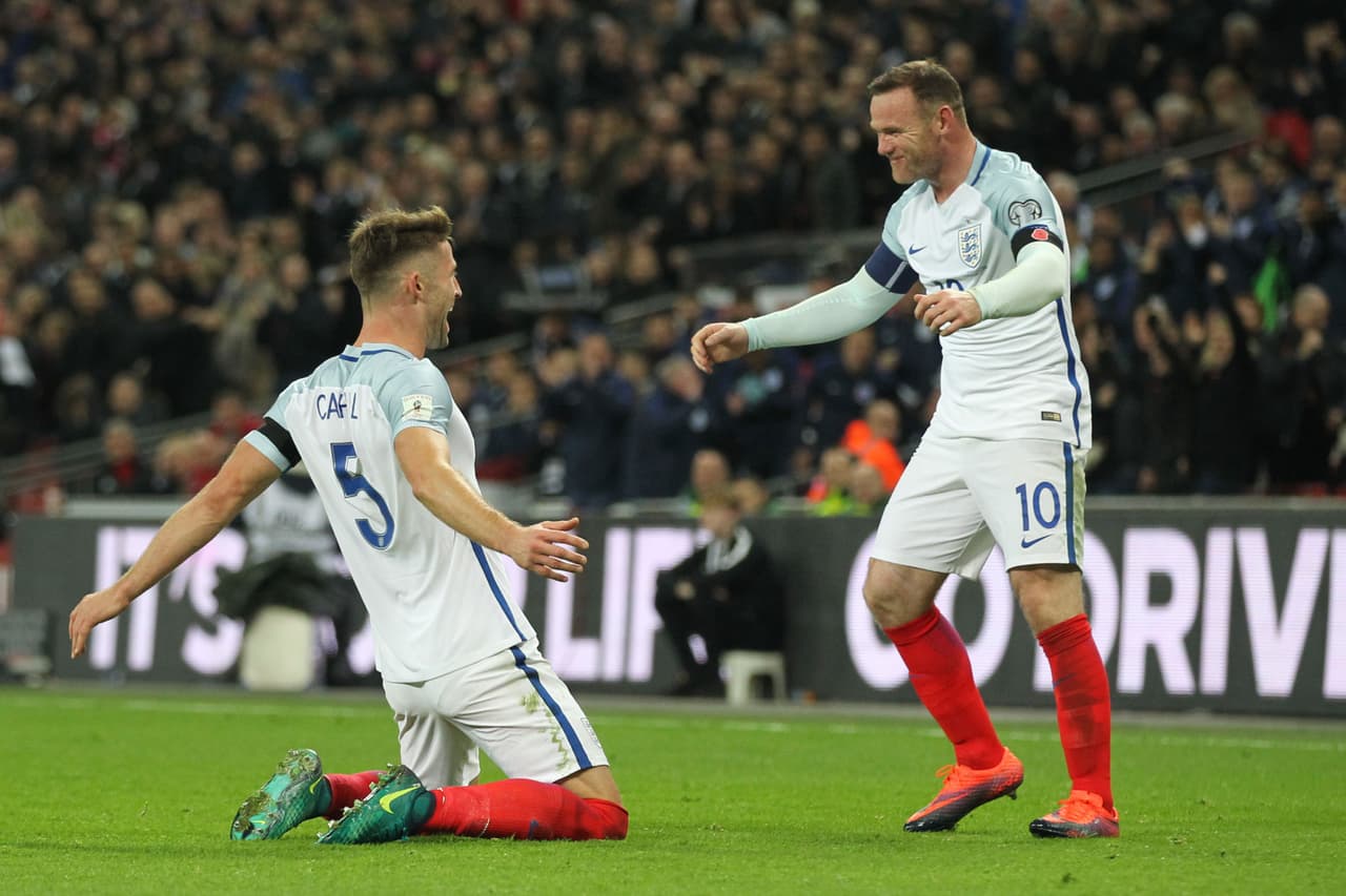 England's defender Gary Cahill (L) celebrates with England's striker Wayne Rooney after scoring their third goal during a World Cup 2018 qualification match between England and Scotland at Wembley stadium in London on November 11, 2016. / AFP / Ian Kington / NOT FOR MARKETING OR ADVERTISING USE / RESTRICTED TO EDITORIAL USE (Photo credit should read IAN KINGTON/AFP/Getty Images)