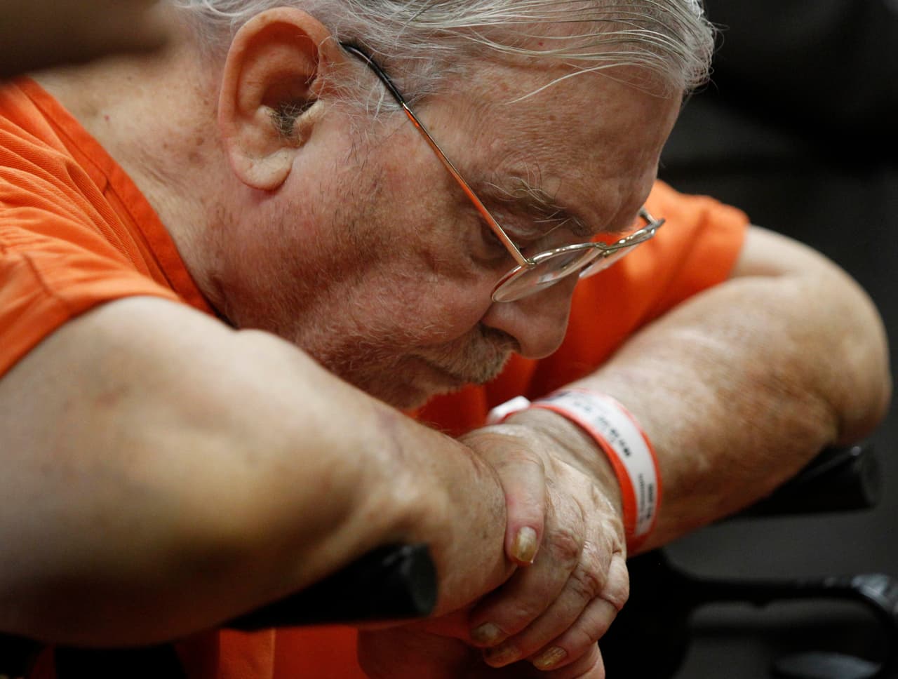 John Feit sits in his walker during his arraignment, Monday, March 14, 2016, at the Hidalgo County Courthouse in Edinburg, Texas. Feit is accused of murdering Irene Garza, a teacher and ex-beauty queen, when he was a priest in 1960. (Nathan Lambrecht/The Monitor via AP)