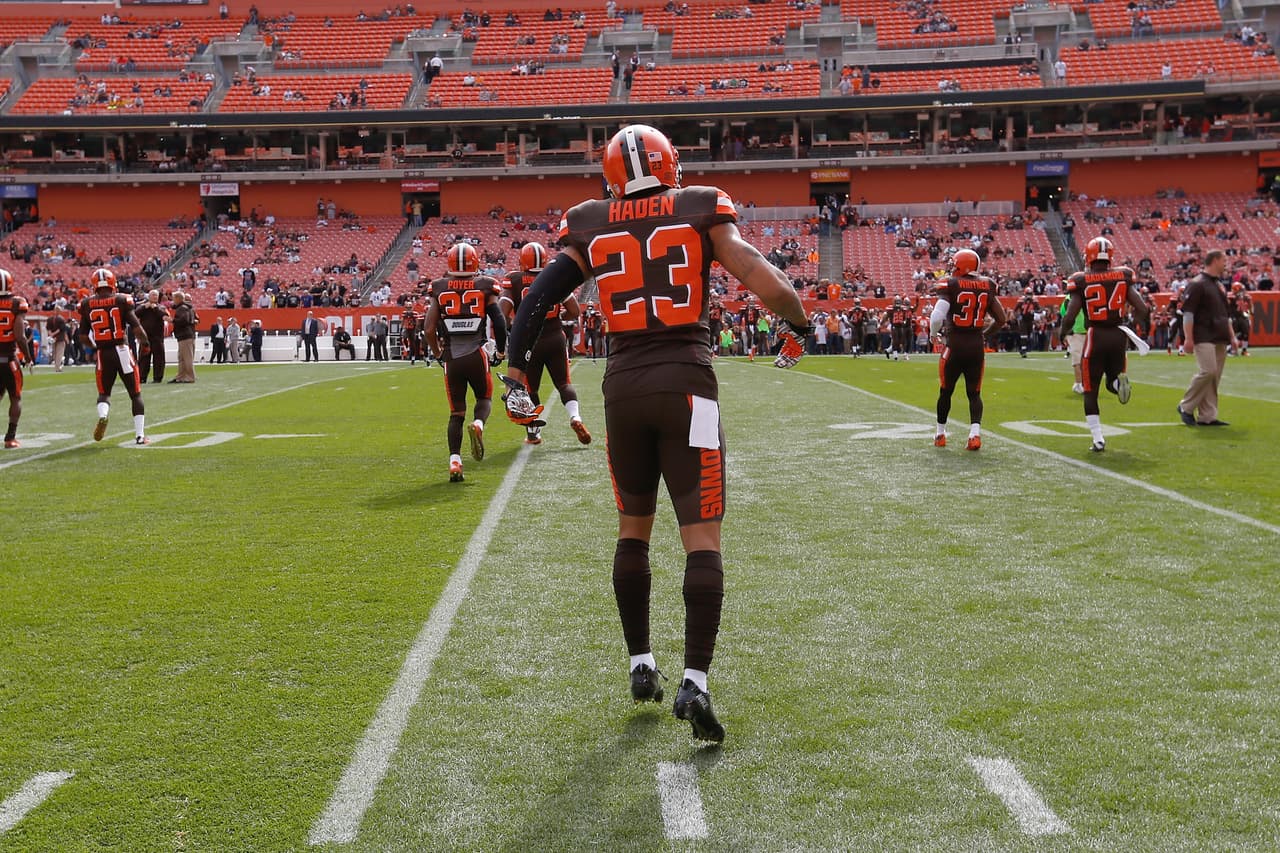 Cleveland Browns cornerback Joe Haden (23) stands on the playing field in pre game warm ups as the back of his jersey can be seen during a week 3 NFL football game against the Oakland Raiders on Sunday, September 27, 2015 in Cleveland. The Raiders defeated the Browns 27-20. (Scott Boehm via AP)