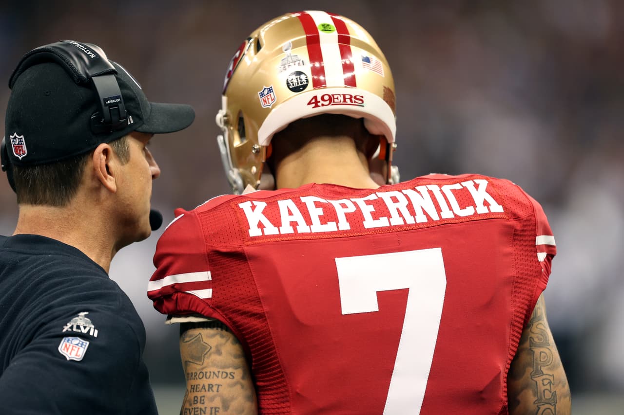 San Francisco 49ers head coach Jim Harbaugh talks with quarterback Colin Kaepernick (7) during the NFL Super Bowl XLVII championship football game against the Baltimore Ravens on Sunday, February 3, 2013 in New Orleans. The Ravens won the game 34-31. (AP Photo/Paul Jasienski)