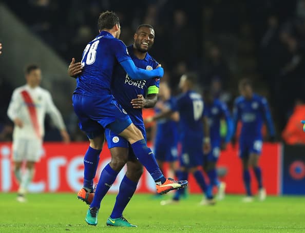 LEICESTER, ENGLAND - NOVEMBER 22: Christian Fuchs and Wes Morgan of Leicester City celebrate victory after the full time whistle in the UEFA Champions League match between Leicester City FC and Club Brugge KV at The King Power Stadium on November 22, 2016 in Leicester, England. (Photo by Richard Heathcote/Getty Images)