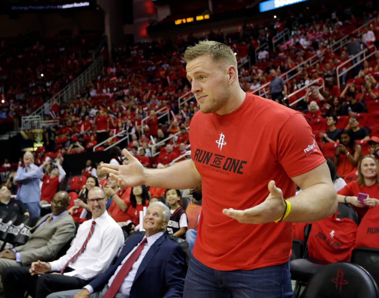 Houston Texans J.J. Watt watches before Game 1 of an NBA basketball first-round playoff series between the Houston Rockets and the Oklahoma City Thunder, Sunday, April 16, 2017, in Houston. (AP Photo/David J. Phillip)