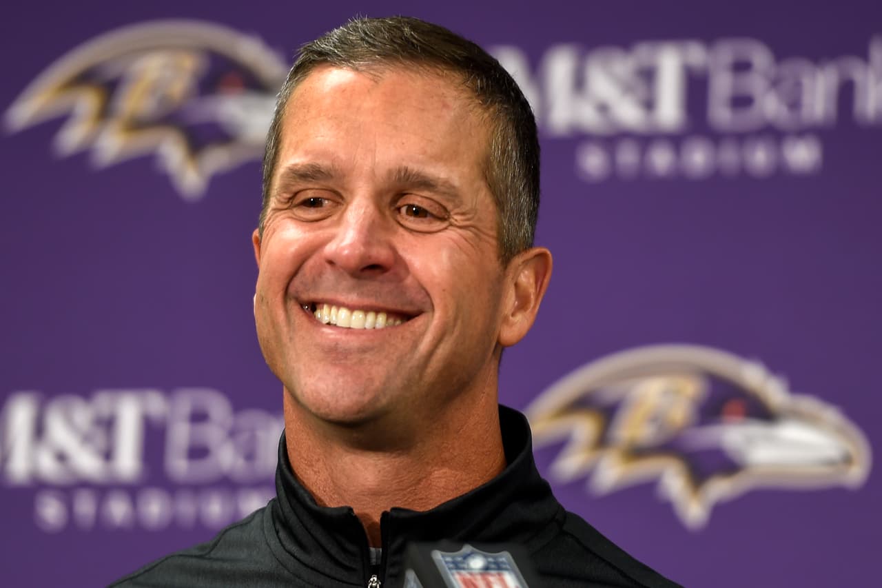 FILE - In this Sunday, Nov. 27, 2016, file photo, Baltimore Ravens head coach John Harbaugh answers a question during a post game press conference after defeating the Cincinnati Bengals 19-14, in Baltimore. With Baltimore leading Cincinnati by seven points, coach Harbaugh told his team to intentionally hold the Bengals to draw penalties while punter Sam Koch ran out of the back of the end zone. The strange but smart strategy ensured a victory for the Ravens rather than risking a fluke fumble or blocked kick. (AP Photo/Gail Burton, File)
