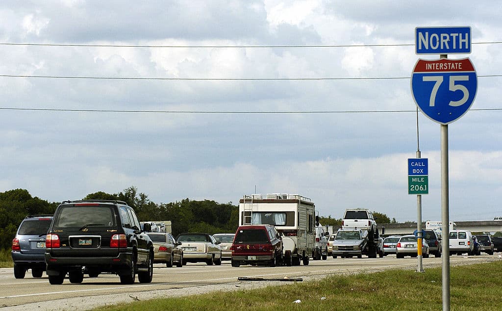 Sarasota, UNITED STATES: Rush-hour commuters mix with voluntary evacuees creating heavy traffic on the northbound I-75, 20 October, 2005, in Sarasota, Florida, as officials issued voluntary evacuation orders for counties in southern Florida ahead of Hurricane Wilma. Florida Governor Jeb Bush declared a state of emergency as Wilma appears to threaten the southeastern US state, but authorities in the Florida Keys island chain postponed mandatory evacuations by a day after the storm's potential arrival was pushed back to next week. AFP PHOTO/Stan HONDA (Photo credit should read STAN HONDA/AFP/Getty Images)