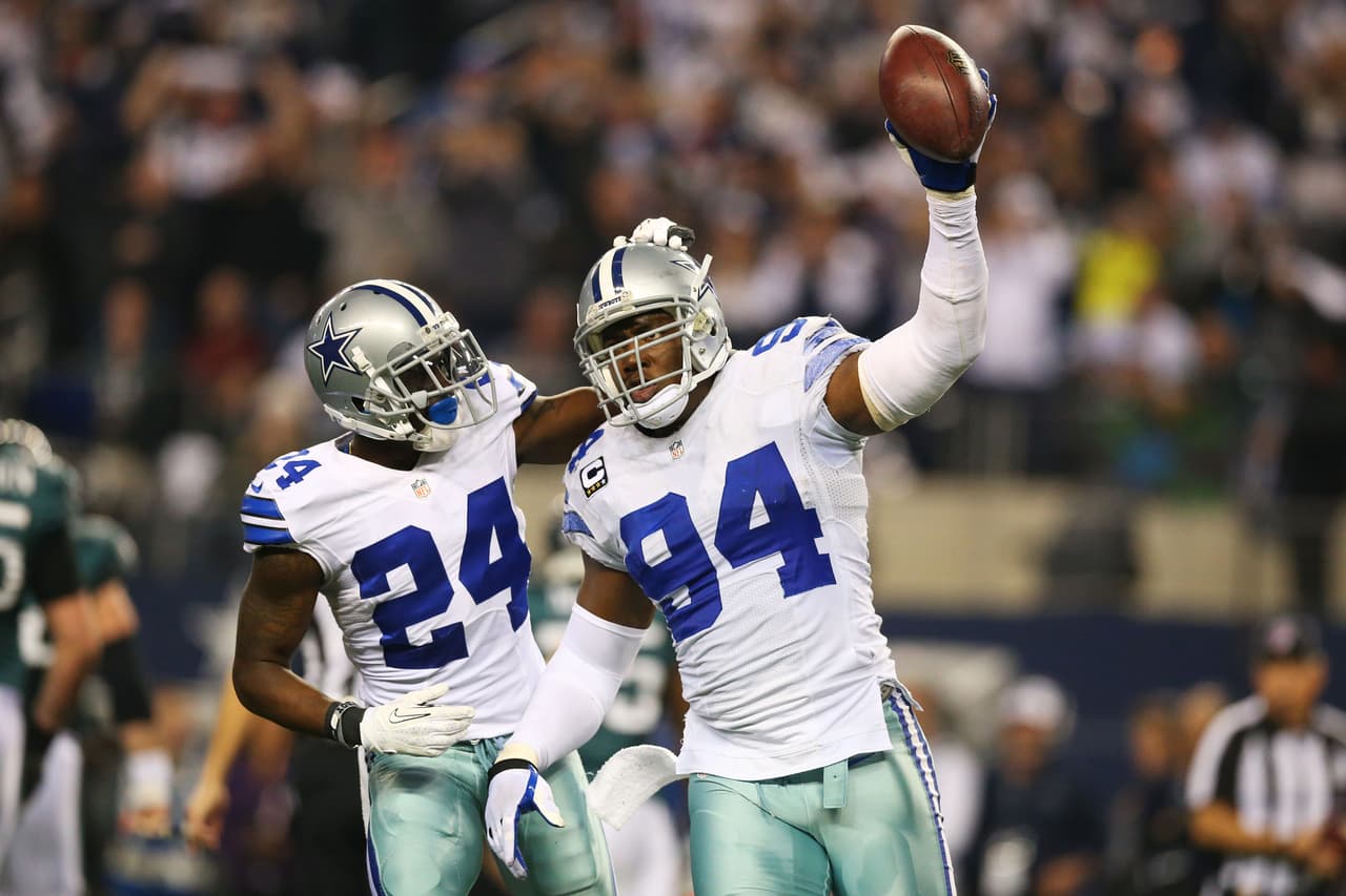 ARLINGTON, TX - DECEMBER 29: DeMarcus Ware #94 and Morris Claiborne #24 of the Dallas Cowboys celebrate in the second half against the Philadelphia Eagles at Cowboys Stadium on December 29, 2013 in Arlington, Texas. (Photo by Ronald Martinez/Getty Images)