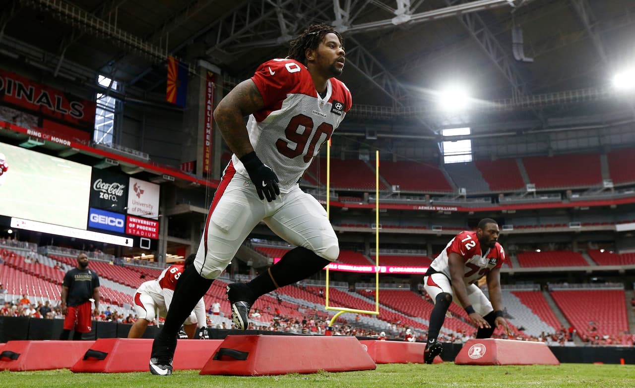 Arizona Cardinals' Robert Nkemdiche (90) and Olsen Pierre (72) run defensive linemen drills during an NFL football training camp Saturday, July 29, 2017, in Glendale, Ariz. (AP Photo/Ross D. Franklin)
