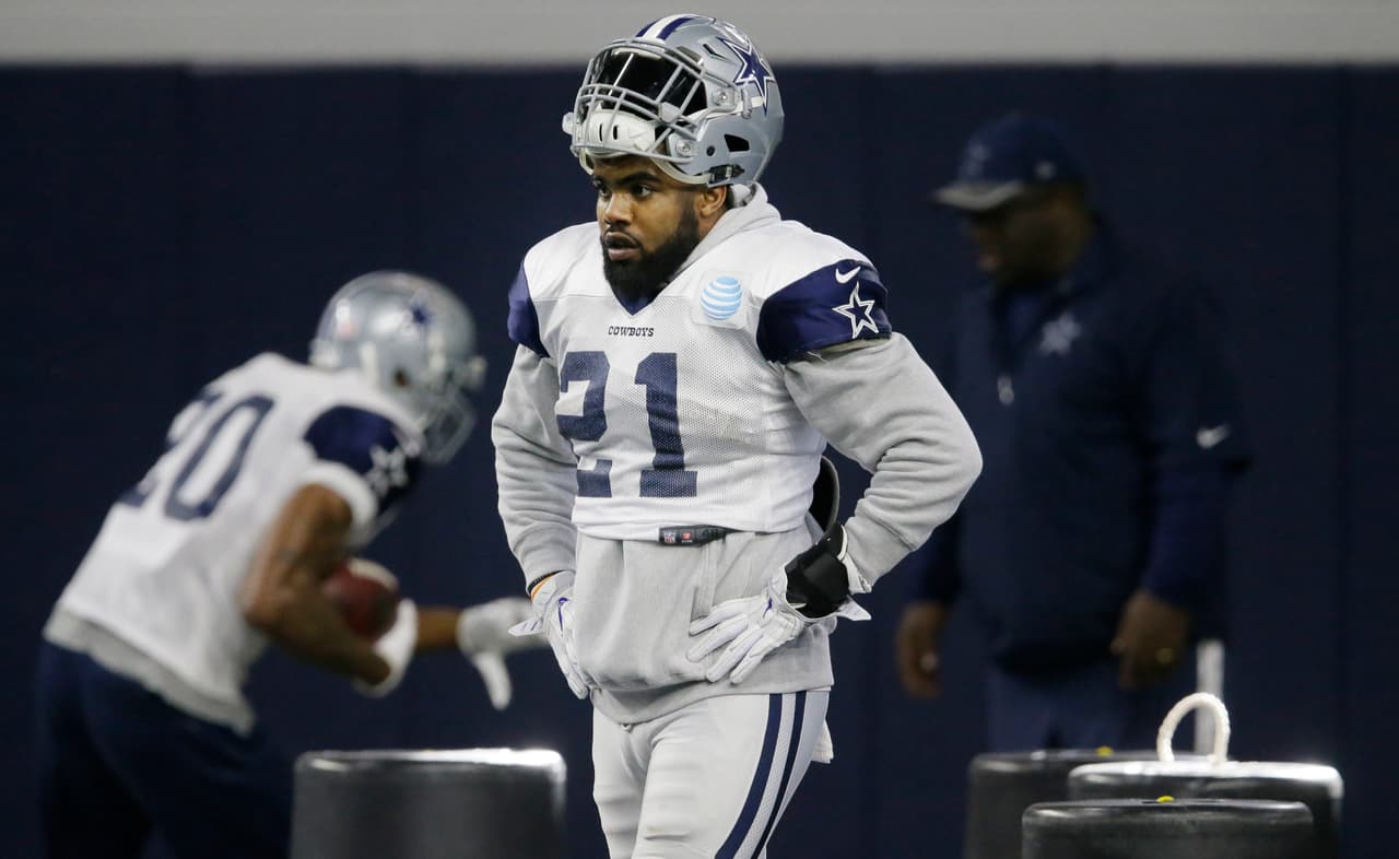 Dallas Cowboys running back Ezekiel Elliott (21) walks the field during an indoor NFL football practice at the team's headquarters in Frisco, Texas, Wednesday, Jan. 11, 2017. The Cowboys face the Green Bay Packers in the NFL playoffs this Sunday. (AP Photo/LM Otero)