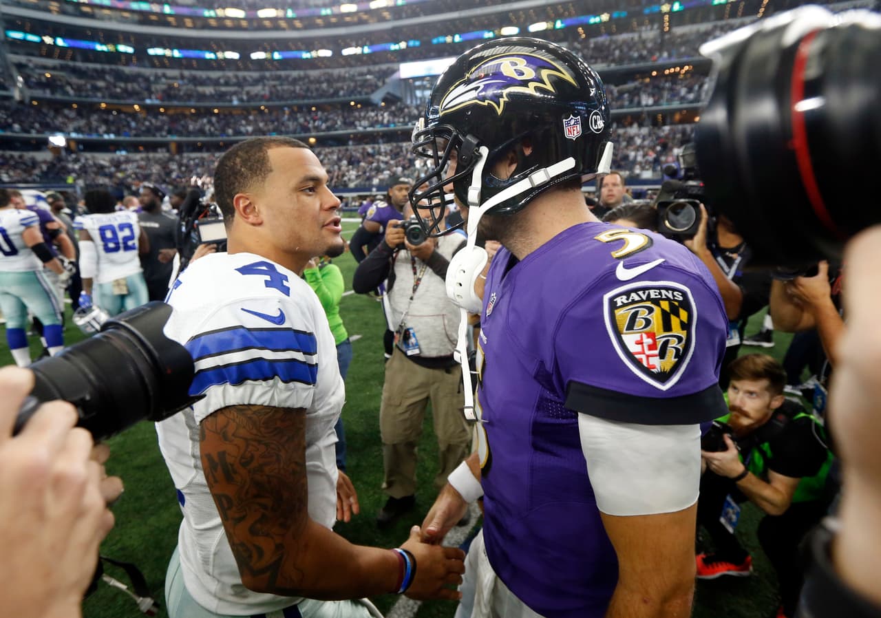 Dallas Cowboys quarterback Dak Prescott (4) and Baltimore Ravens quarterback Joe Flacco (5) greet each other after their NFL football game, Sunday, Nov. 20, 2016, in Arlington, Texas. (AP Photo/Michael Ainsworth)