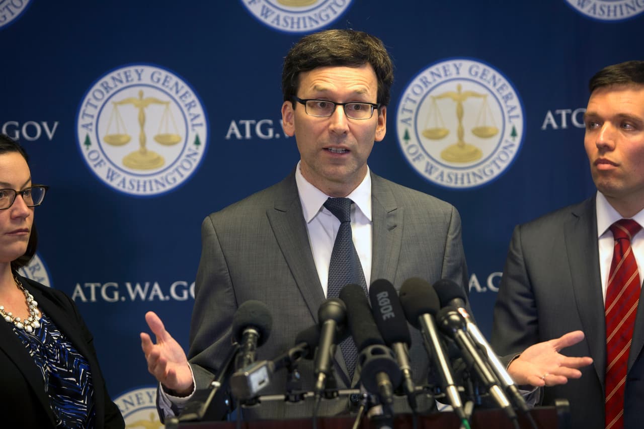SEATTLE, WA - MARCH 09: Washington State Attorney General Bob Ferguson (C) with Washington State Assistant Attorney General Colleen Melody (L) and Washington State Solicitor General Noah Purcell (R) announces his decision on potential action regarding President Donald Trump's latest Executive Order on immigration on March 9, 2017 in Seattle, Washington. (Photo by Karen Ducey/Getty Images)