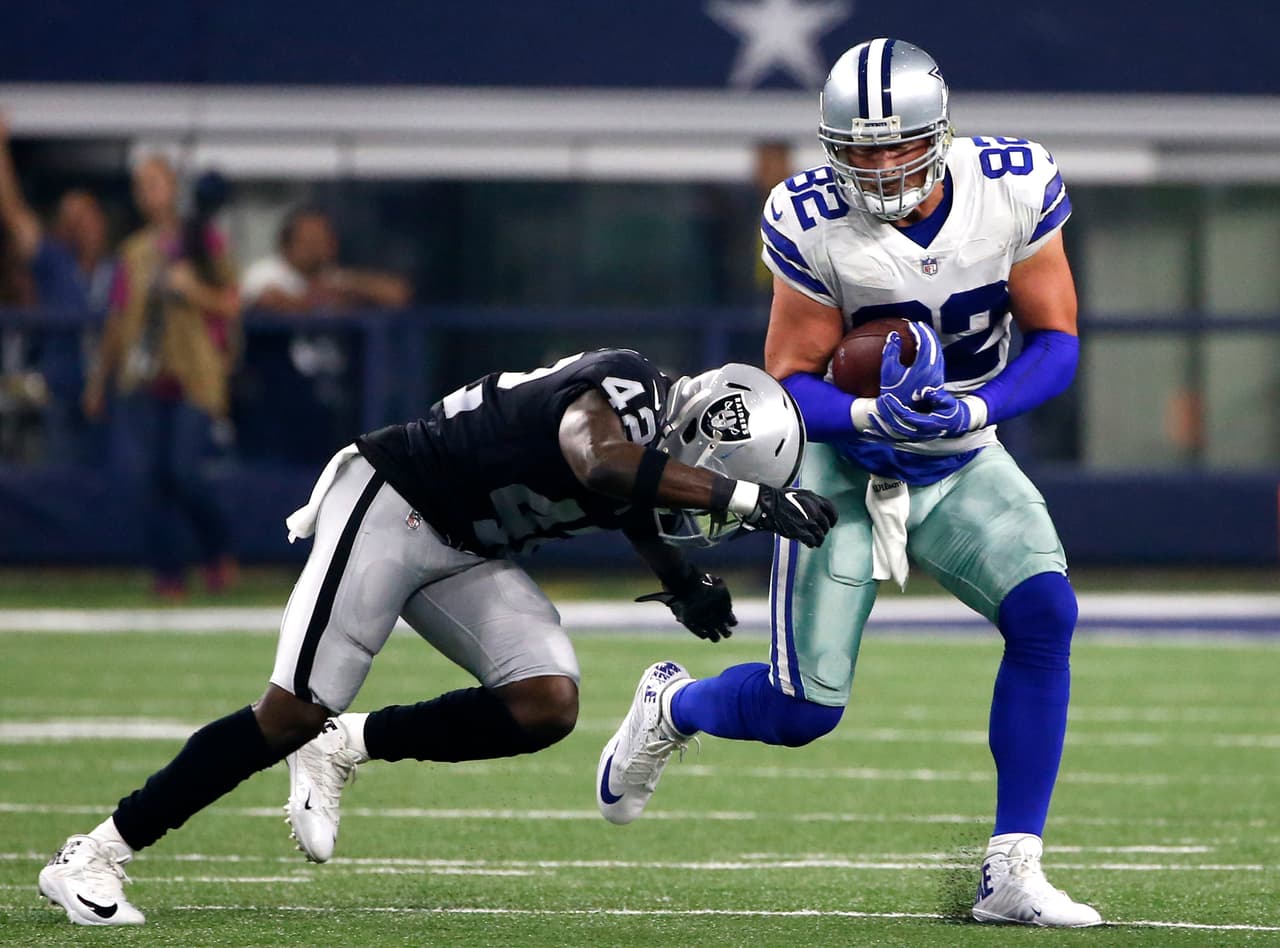 Oakland Raiders safety Karl Joseph (42) attempts to stop Dallas Cowboys tight end Jason Witten (82) as Witten gains yardage after a catch in the first half of a preseason NFL football game, Saturday, Aug. 26, 2017, in Arlington, Texas. (AP Photo/Ron Jenkins)