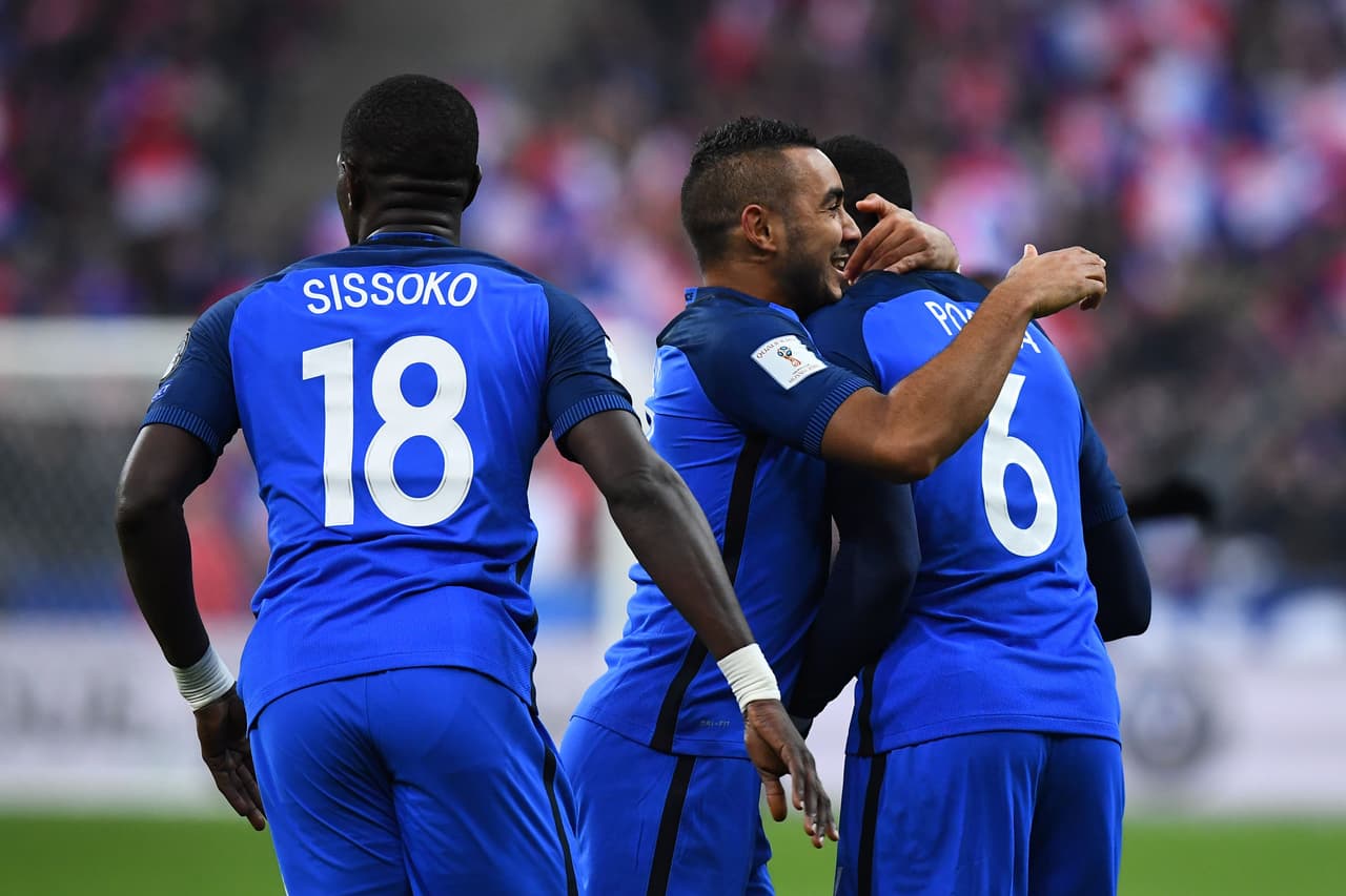 France's midfielder Paul Pogba (R) celebrates with France's midfielder Dimitri Payet (C) and France's midfielder Moussa Sissoko (L) after scoring a goal during the 2018 World Cup group A qualifying football match between France and Sweden at the Stade de France in Saint-Denis, north of Paris, on November 11, 2016. / AFP / FRANCK FIFE (Photo credit should read FRANCK FIFE/AFP/Getty Images)