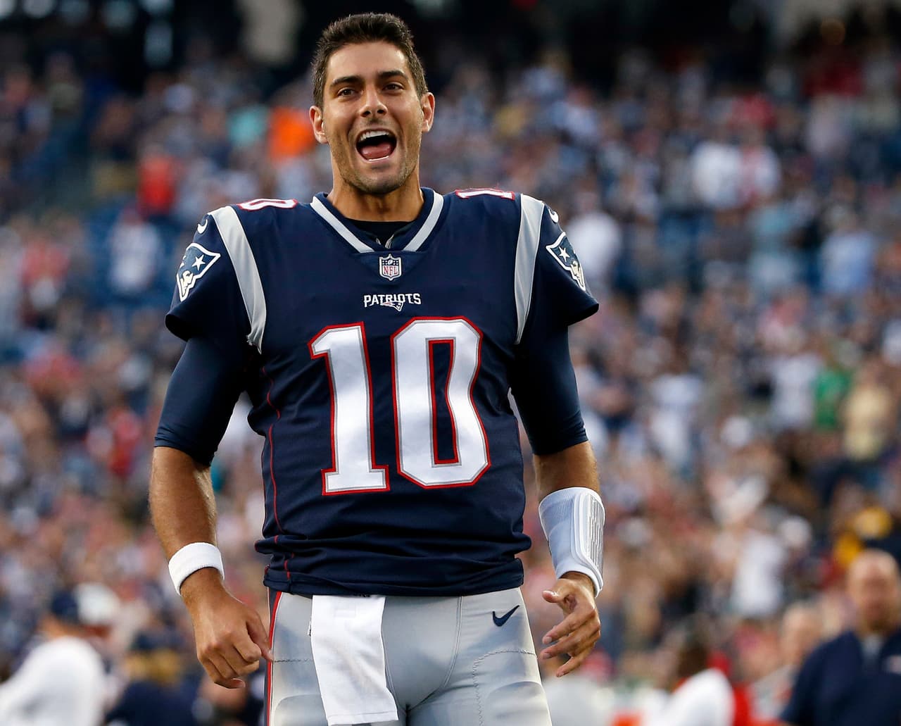 New England Patriots quarterback Jimmy Garoppolo runs onto the field before an NFL preseason football game against the Jacksonville Jaguars, Thursday, Aug. 10, 2017, in Foxborough, Mass. (AP Photo/Mary Schwalm)