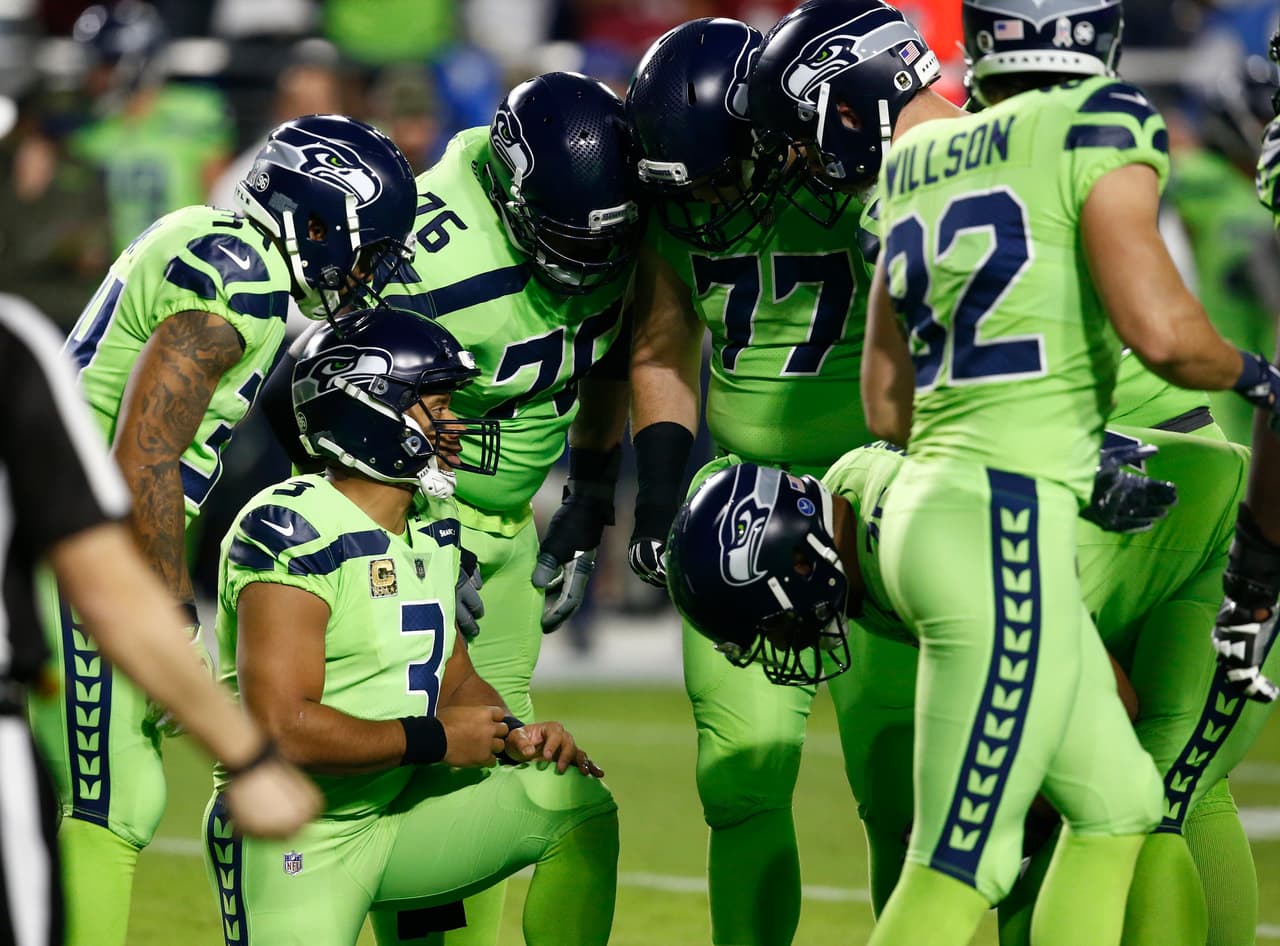 Seattle Seahawks quarterback Russell Wilson (3) huddles up his team during the first half of an NFL football game against the Arizona Cardinals, Thursday, Nov. 9, 2017, in Glendale, Ariz. (AP Photo/Ross D. Franklin)