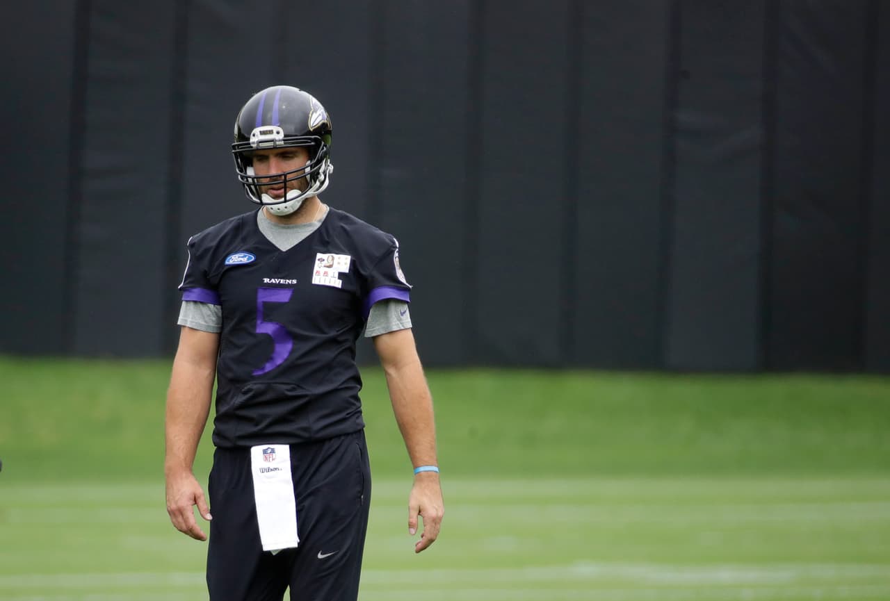 Baltimore Ravens quarterback Joe Flacco walks on the field during NFL football practice at the team's practice facility in Owings Mills, Md., Thursday, May 25, 2017. (AP Photo/Patrick Semansky)