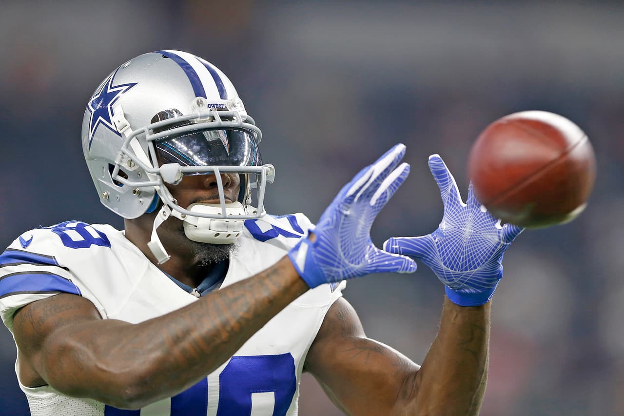 Dallas Cowboys receiver Dez Bryant (88) reaches for a catch before the 2016 NFL week 3 regular season game against the Chicago Bears, Sunday, Sept. 25, 2016, in Arlington, Texas. The Cowboys defeated the Bears, 31-17. (James D. Smith via AP)