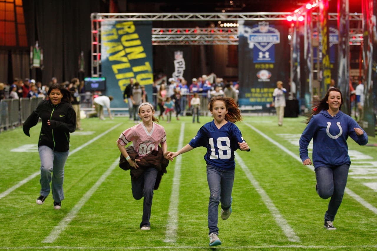 INDIANAPOLIS, IN - FEBRUARY 03: Fans run through an obstacle course at the Super Bowl XLVI NFL Experience presented by GMC at the Indiana Convention Center on February 3, 2012 in Indianapolis, Indiana. The New England Patriots will play the New York Giants in Super Bowl XLVI on February 5, 2011 at Lucas Oil Stadium in Indianapolis, Indiana. (Photo by Chris Graythen/Getty Images)