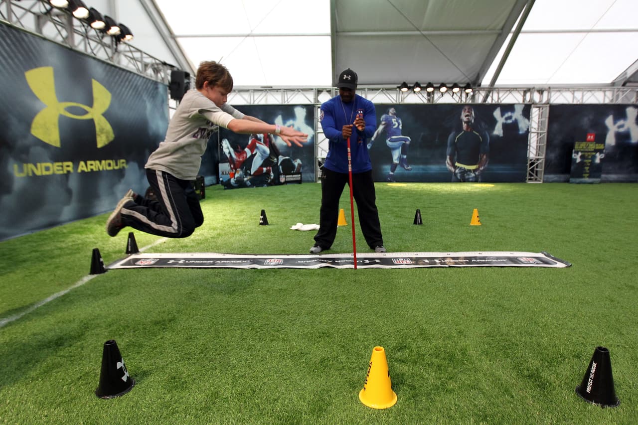 INDIANAPOLIS, IN - FEBRUARY 01: A young fan participates in the Super Bowl XLVI NFL Experience presented by GMC at the Indiana Convention Center on February 1, 2012 in Indianapolis, Indiana. (Photo by Andy Lyons/Getty Images)