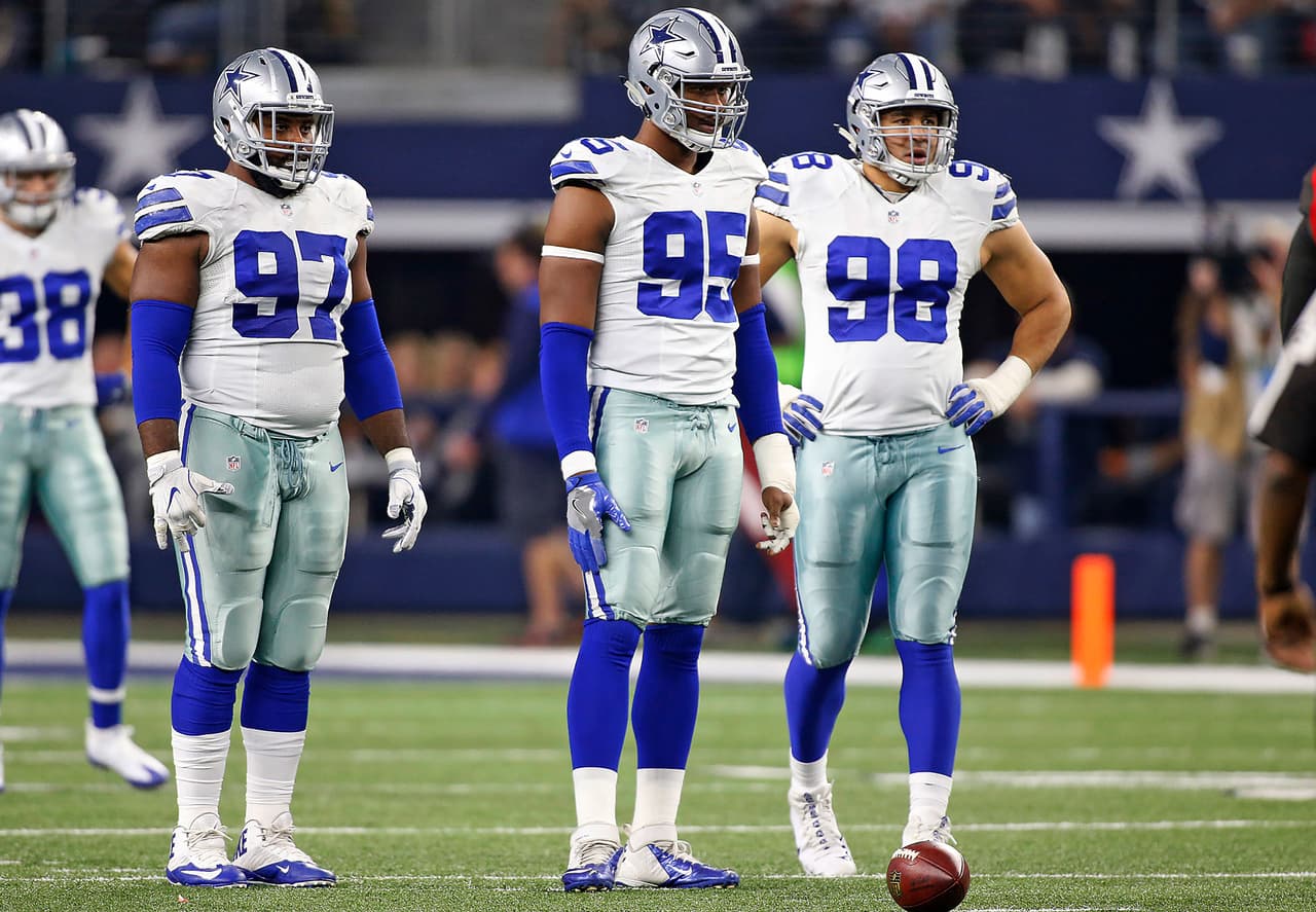 Dallas Cowboys defensive linemen Terrell McClain (97), David Irving (95) and Tyrone Crawford (98) stand as they wait for the next play during the 2016 NFL week 15 regular season game against the Tampa Bay Buccaneers, Sunday, Dec. 18, 2016, in Arlington, Texas. The Cowboys defeated the Buccaneers, 26-20. (James D. Smith via AP)