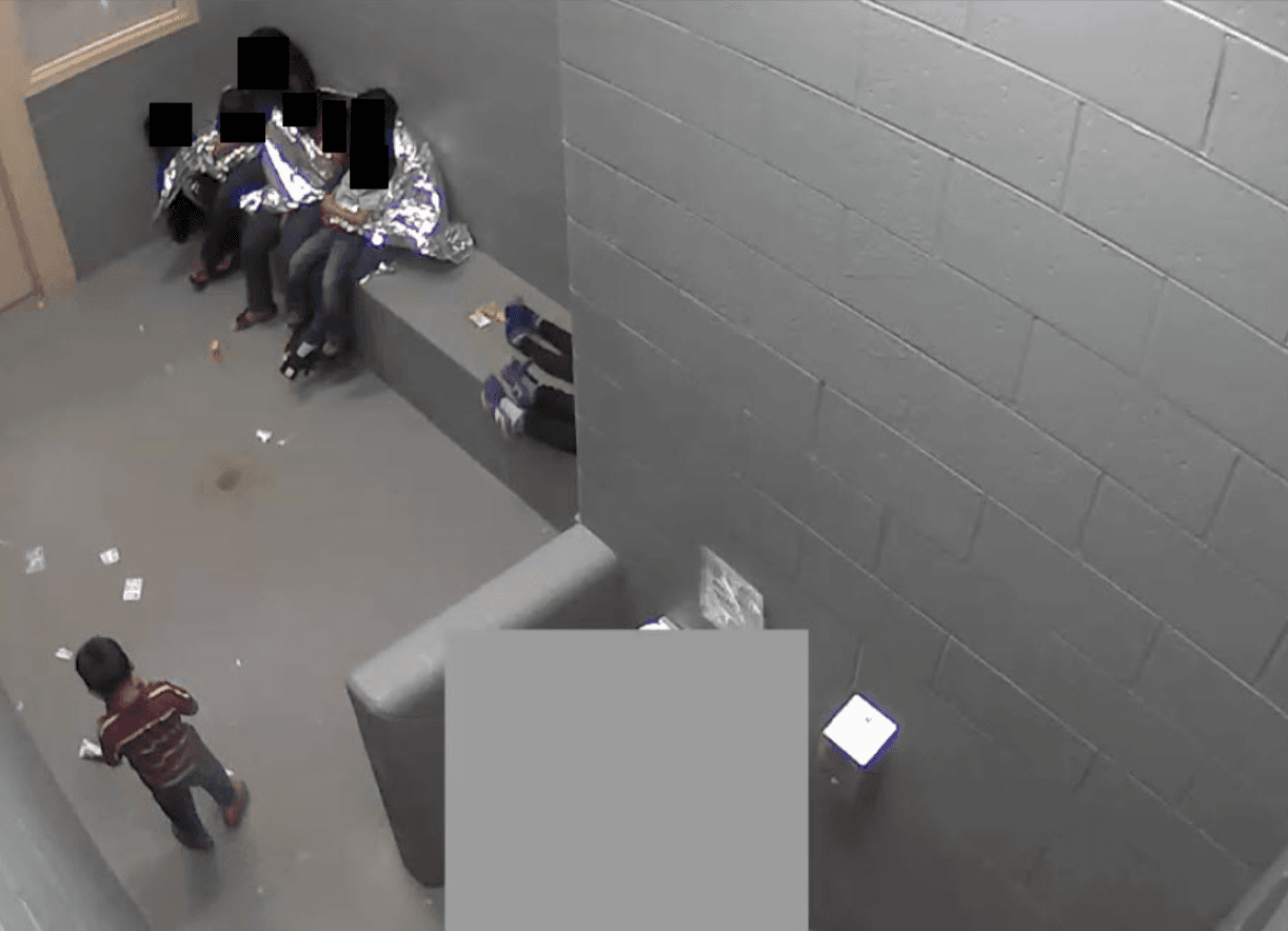 Adults and children have nowhere to sleep at the Border Patrol's Naco facility in September 2015.