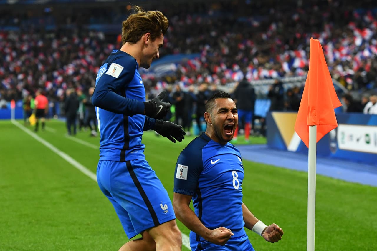 France's midfielder Dimitri Payet celebrates with France's forward Antoine Griezmann (L) after scoring a goal during the 2018 World Cup group A qualifying football match between France and Sweden at the Stade de France in Saint-Denis, north of Paris, on November 11, 2016. / AFP / FRANCK FIFE (Photo credit should read FRANCK FIFE/AFP/Getty Images)