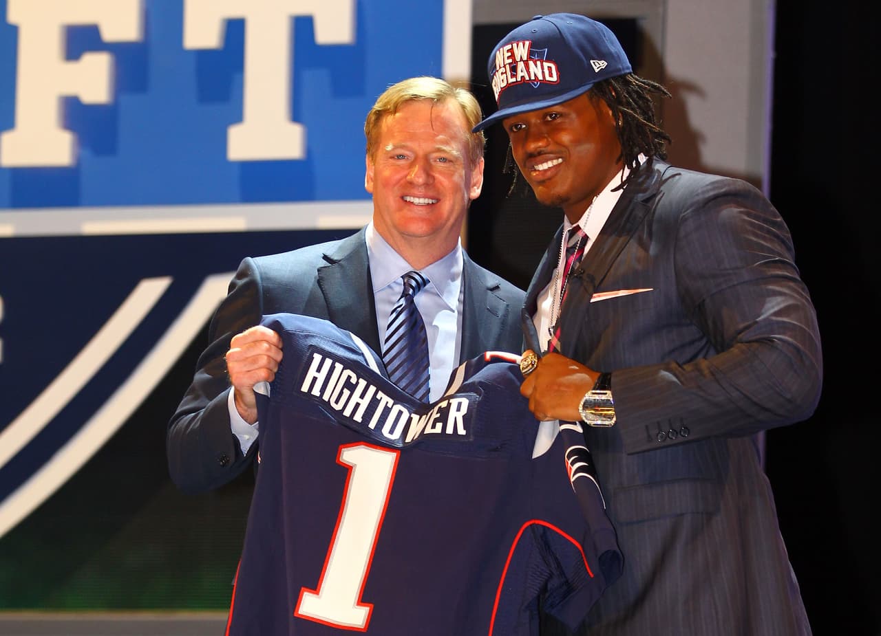 NEW YORK, NY - APRIL 26: Dont'a Hightower of Alabama holds up a jersey as he stands on stage with NFL Commissioner Roger Goodell after he was selected #25 overall by the New England Patriots in the first round of the 2012 NFL Draft at Radio City Music Hall on April 26, 2012 in New York City. (Photo by Al Bello/Getty Images)