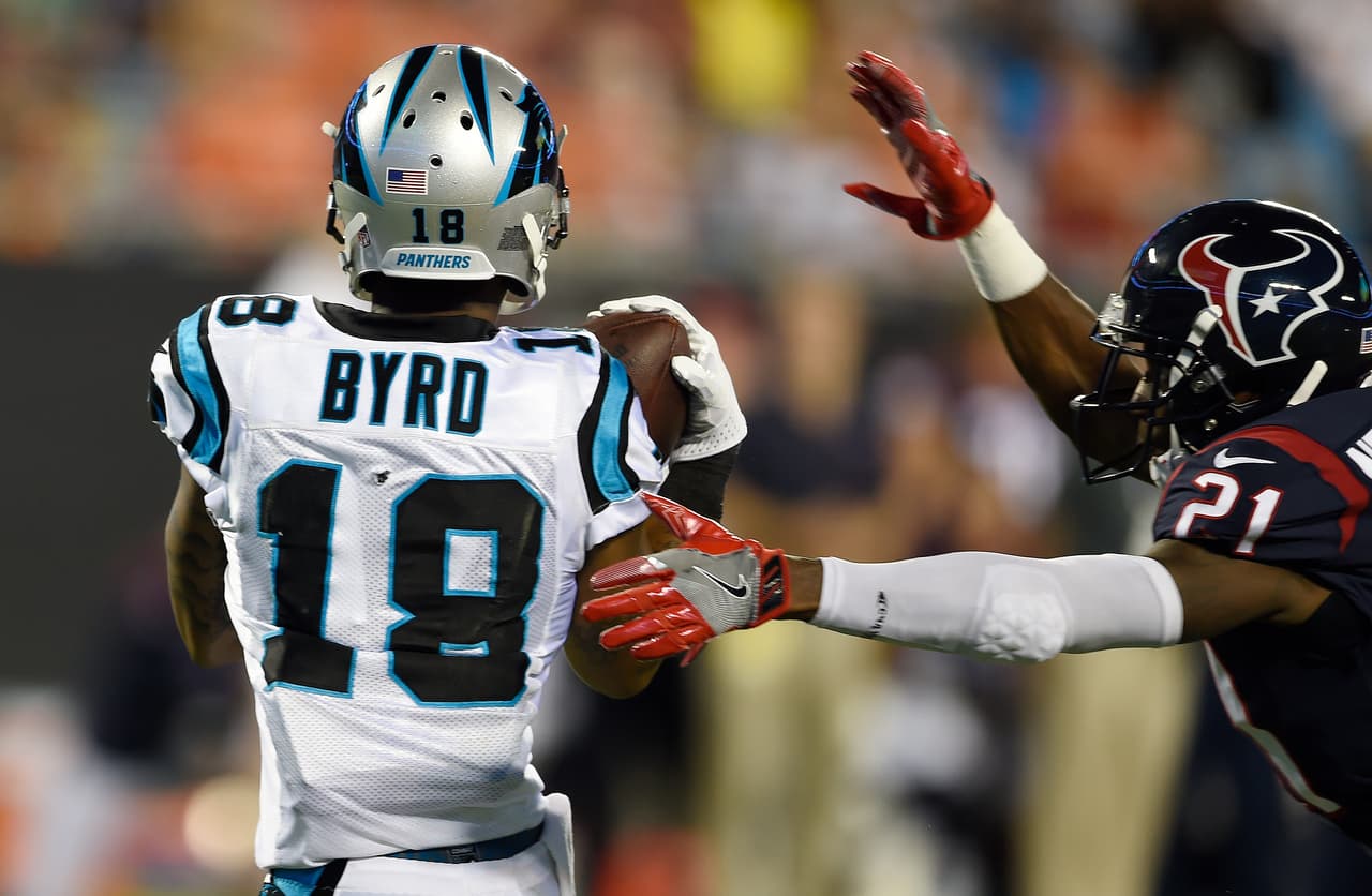 Carolina Panthers wide receiver Damiere Byrd (18) makes a touchdown catch against Houston Texans defensive back Marcus Gilchrist (21) during the first half of an NFL preseason football game, Wednesday, Aug. 9, 2017, in Charlotte, N.C. (AP Photo/Mike McCarn)