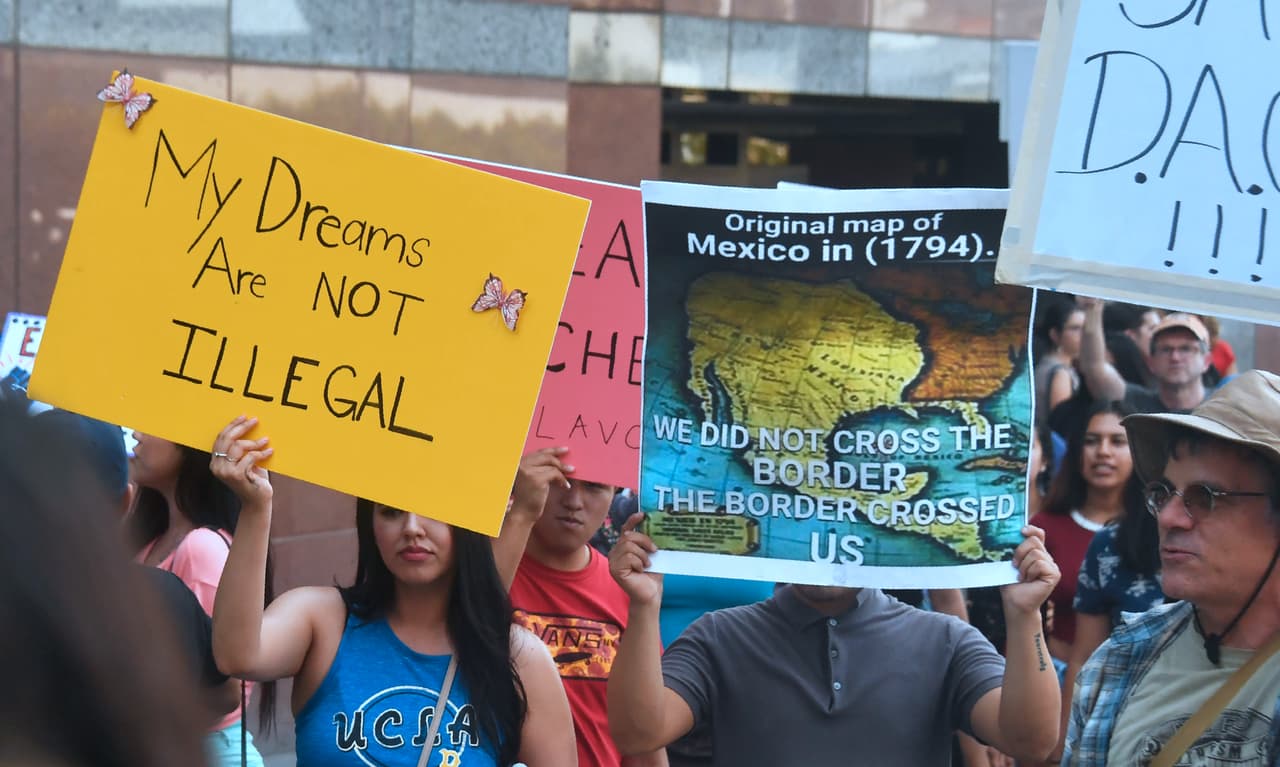 A map of Mexico as it was in 1794 is displayed as young immigrants and their supporters rally in support of Deferred Action for Childhood Arrivals (DACA) in Los Angeles, California on September 1, 2017. A decision is expected in coming days on whether US President Trump will end the program by his predecessor, former President Obama, on DACA which has protected some 800,000 undocumented immigrants, also known as Dreamers, since 2012. / AFP PHOTO / FREDERIC J. BROWN (Photo credit should read FREDERIC J. BROWN/AFP/Getty Images)