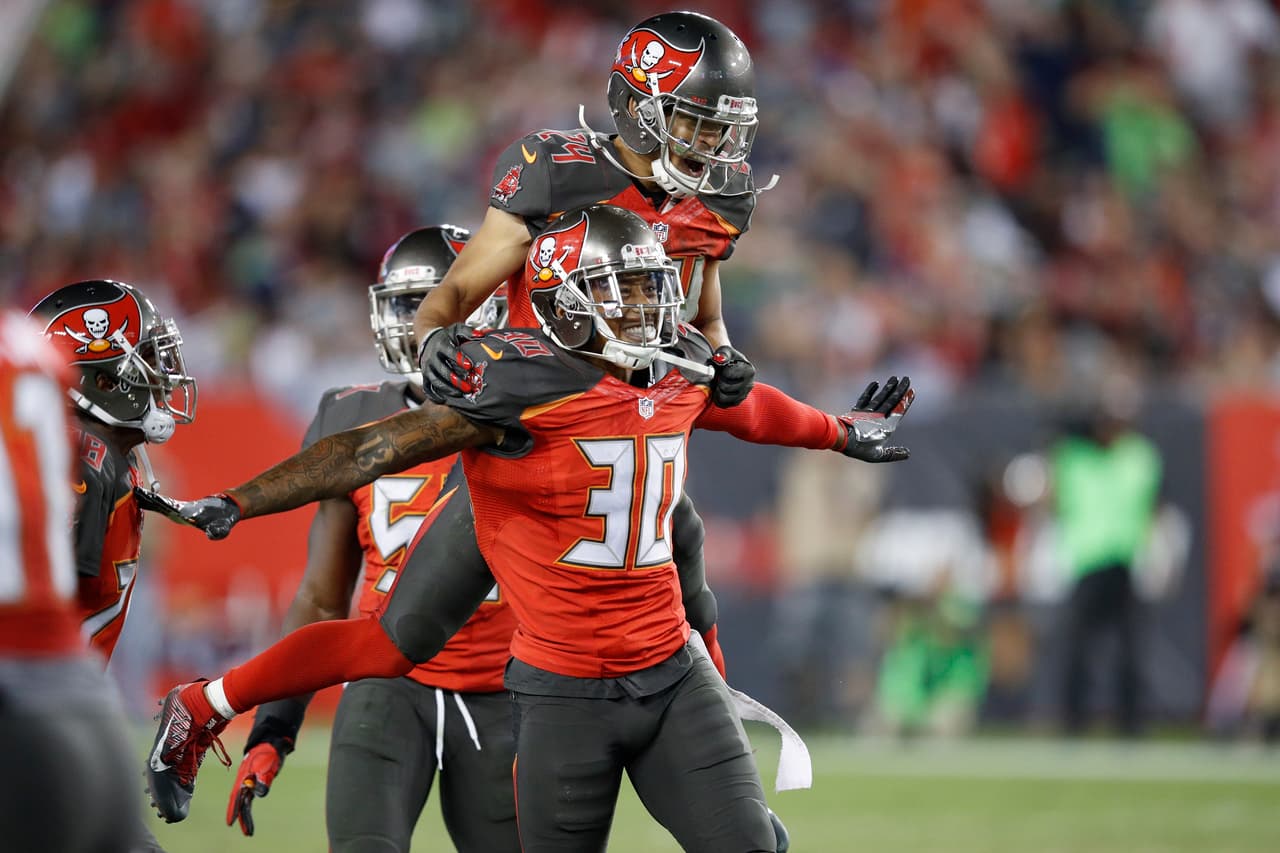 TAMPA, FL - NOVEMBER 27: Bradley McDougald #30 and Brent Grimes #24 of the Tampa Bay Buccaneers celebrate after a fourth down stop against Seattle Seahawks in the fourth quarter of the game at Raymond James Stadium on November 27, 2016 in Tampa, Florida. The Buccaneers defeated the Seahawks 14-5. (Photo by Joe Robbins/Getty Images)