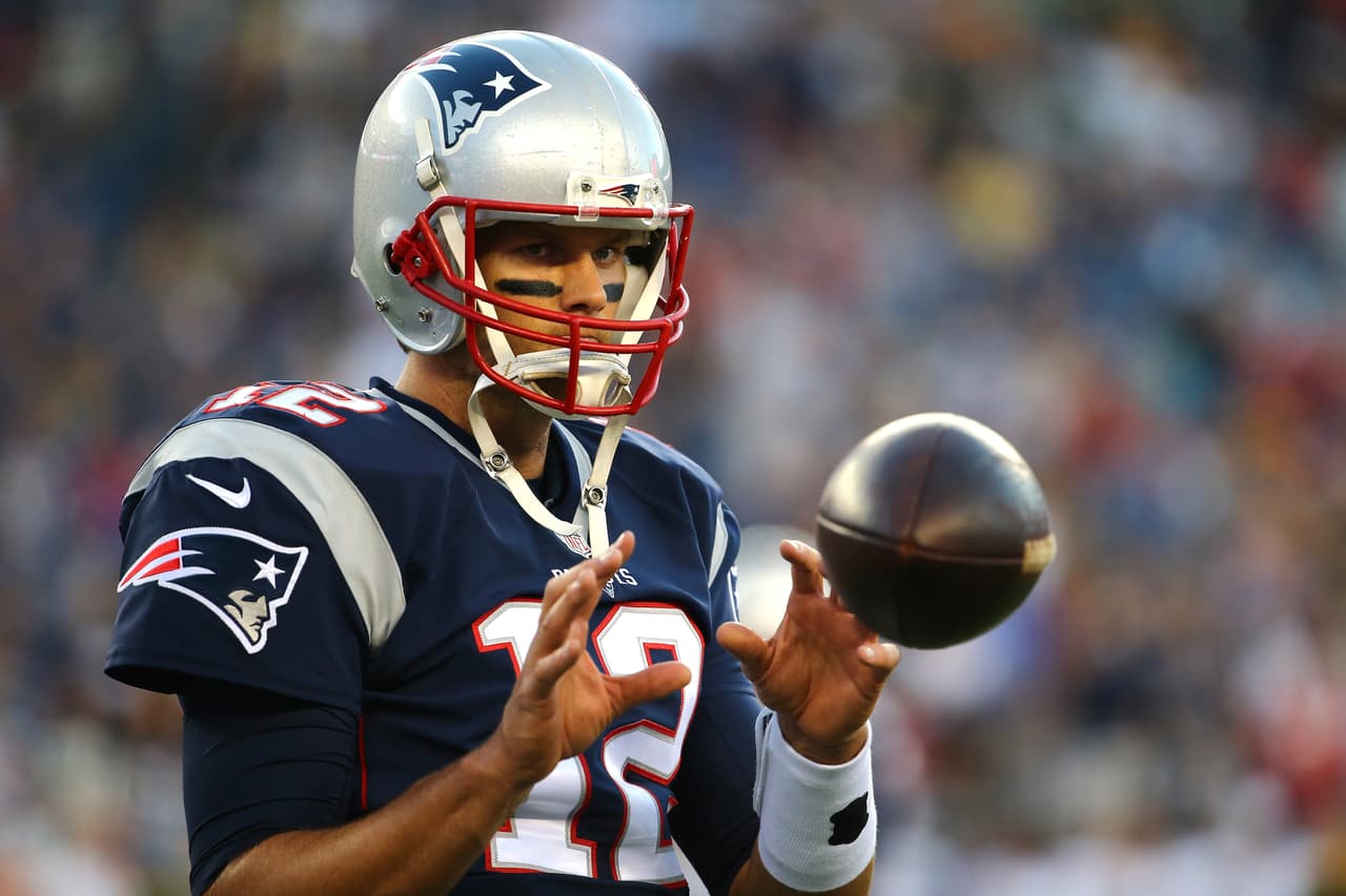 FOXBORO, MA - AUGUST 13: Tom Brady #12 of the New England Patriots warms up prior to a preseason game against the Green Bay Packers at Gillette Stadium on August 13, 2015 in Foxboro, Massachusetts. (Photo by Maddie Meyer/Getty Images)