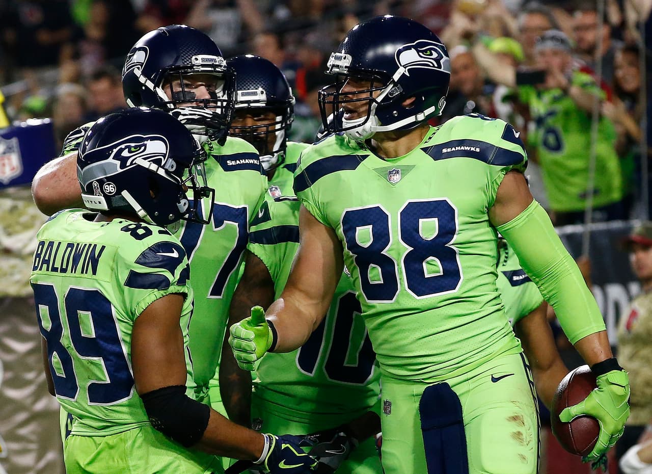 Seattle Seahawks tight end Jimmy Graham (88) celebrates his touchdown against the Arizona Cardinals with wide receiver Doug Baldwin (89) during the first half of an NFL football game, Thursday, Nov. 9, 2017, in Glendale, Ariz. (AP Photo/Ross D. Franklin)