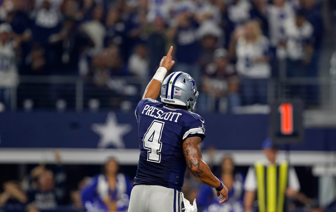 Dallas Cowboys quarterback Dak Prescott (4) celebrates during an NFL football game against the Washington Redskins on Thursday, Nov. 24, 2016, in Arlington, Texas. Dallas won 31-26. (Aaron M. Sprecher via AP)