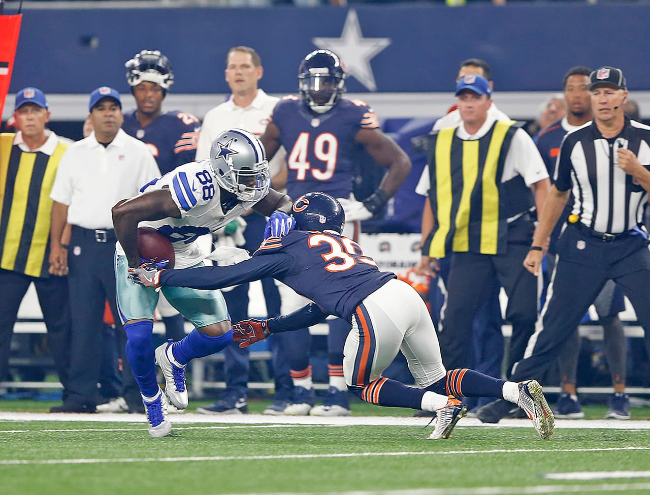 Dallas Cowboys receiver Dez Bryant (88) is tackled after a catch by Chicago Bears defensive back Jacoby Glenn (39) during the 2016 NFL week 3 regular season game, Sunday, Sept. 25, 2016, in Arlington, Texas. The Cowboys defeated the Bears, 31-17. (James D. Smith via AP)