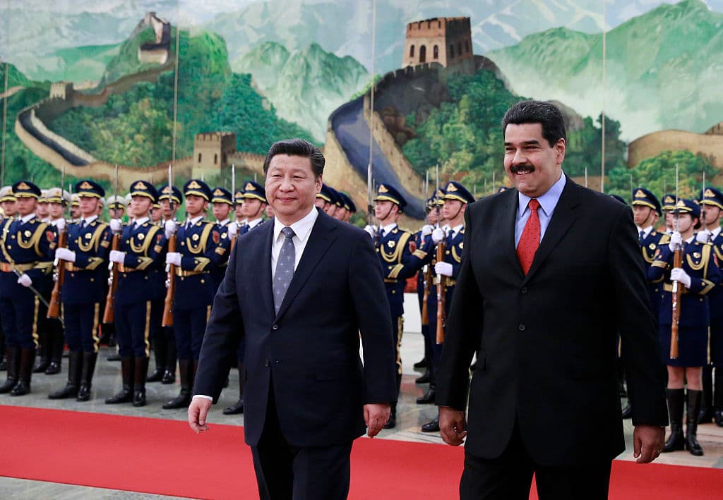 Venezuela's President Nicolas Maduro walks with Chinese President Xi Jinping as they arrive to a welcoming ceremony at the Great Hall of the People on January 7, 2015 in Beijing, China.