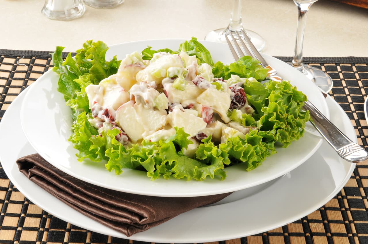 A Waldorf salad with lettuce, apple and walnuts