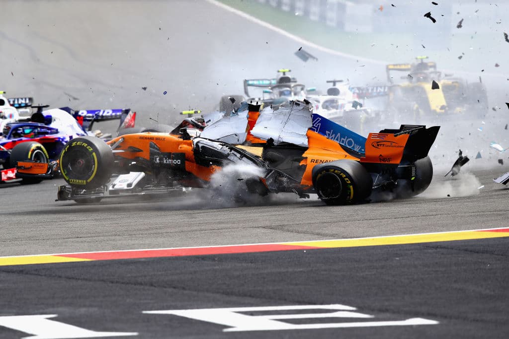 SPA, BELGIUM - AUGUST 26: Fernando Alonso of Spain driving the (14) McLaren F1 Team MCL33 Renault launches over the top of Charles Leclerc of Monaco driving the (16) Alfa Romeo Sauber F1 Team C37 Ferrari at the start during the Formula One Grand Prix of Belgium at Circuit de Spa-Francorchamps on August 26, 2018 in Spa, Belgium. (Photo by Mark Thompson/Getty Images)