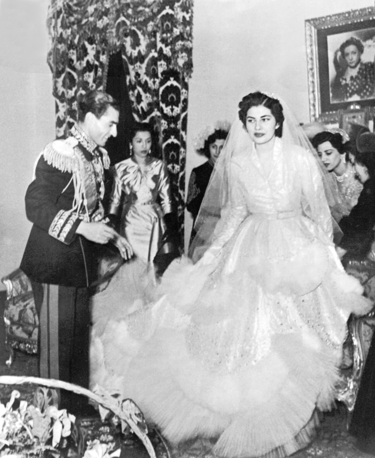 <b>1951 - Soraya Esfandiary and Shah Reza Pahlavi of Iran</b>
<br>Iran’s last empress was married with a silver lame gown by Christian Dior that weighed 30 kilos (66 pounds), adorned with 6,000 diamonds and 20,000 marabou feathers. Seven years later, her husband 
<a href="http://www.lavanguardia.com/hemeroteca/20160816/403962911071/reza-pahlevi-sha-de-persia-soraya-boda.html">repudiated her</a> because they had no children.