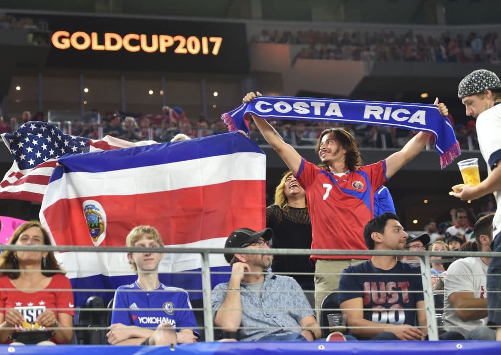 Fans of Costa Rica cheer before the CONCACAF Gold Cup semifinal match between Costa Rica and the USA in Arlington, Texas, on July 22, 2017. / AFP PHOTO / Nicholas Kamm (Photo credit should read NICHOLAS KAMM/AFP/Getty Images)
