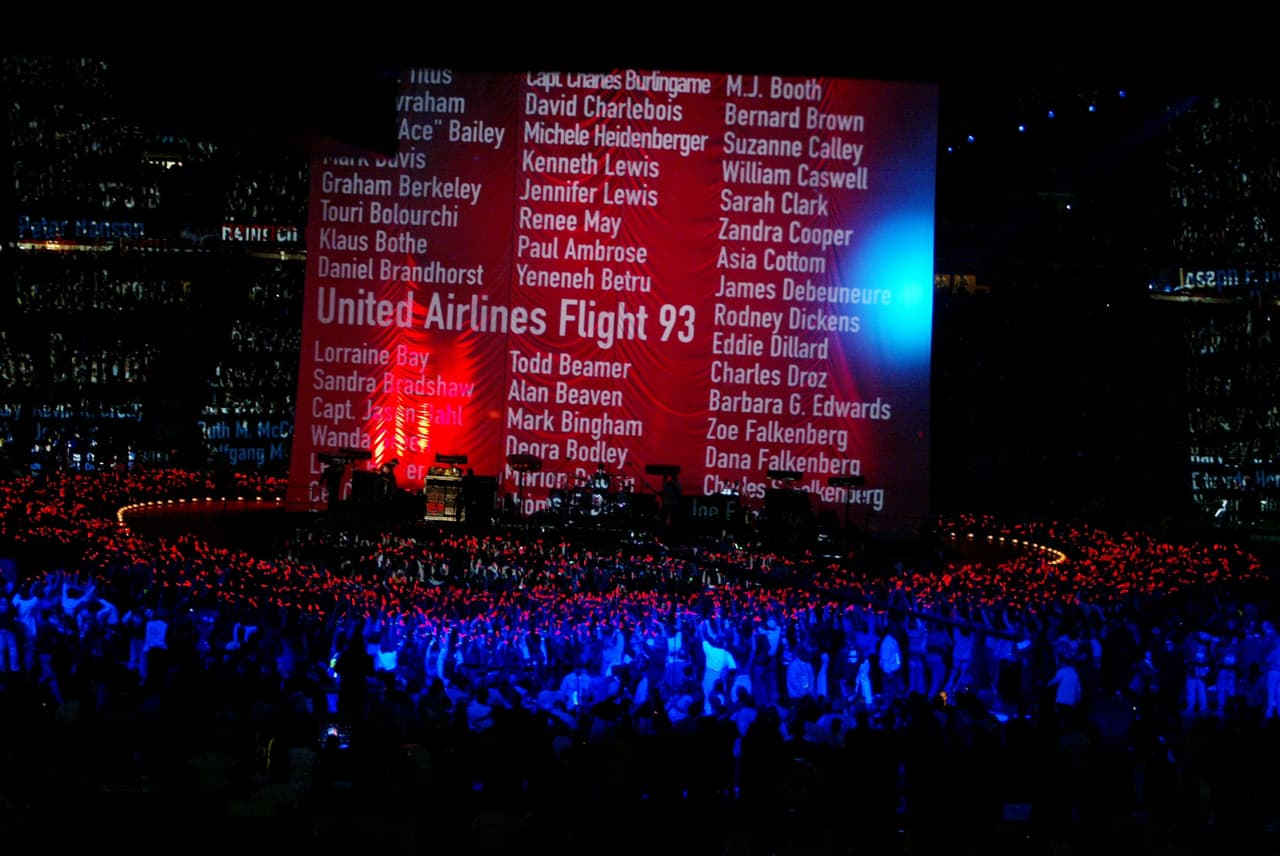03 Feb 2002: A banner displays names of victims of the september 11 attacks during a performance by the band U2 during the halftime show of Superbowl XXXVI at the Superdome in New Orleans, Louisiana. The Patriots defeated the Rams 20-17. DIGITAL IMAGE. Mandatory Credit: Al Bello/Getty Images