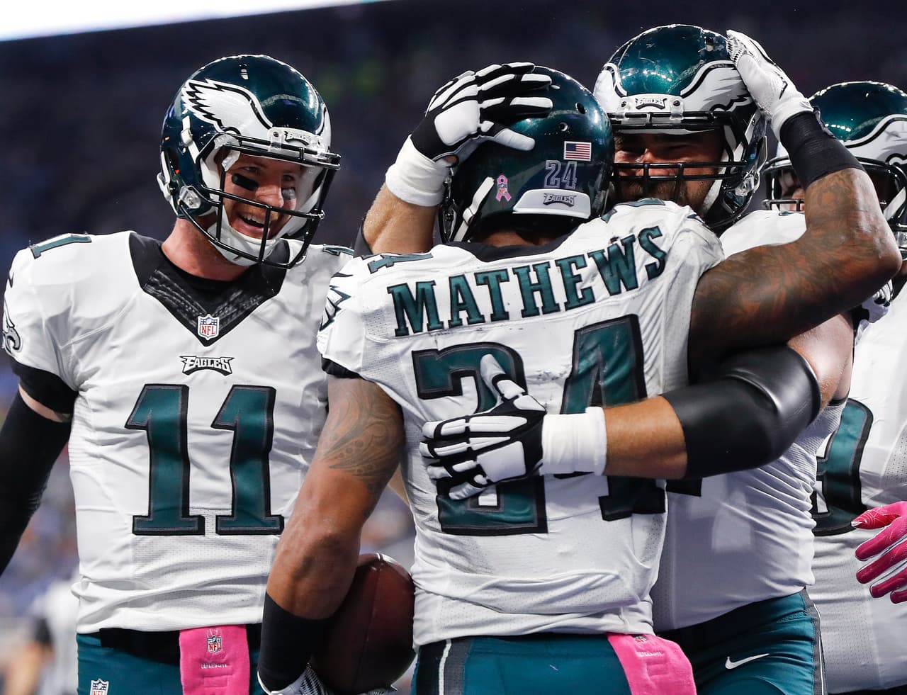 Philadelphia Eagles running back Ryan Mathews (24) celebrates his touchdown with center Jason Kelce and quarterback Carson Wentz (11) against the Detroit Lions during an NFL football game in Detroit, Sunday, Oct. 9, 2016. Detroit beat Philadelphia 24-23. (AP Photo/Paul Sancya)