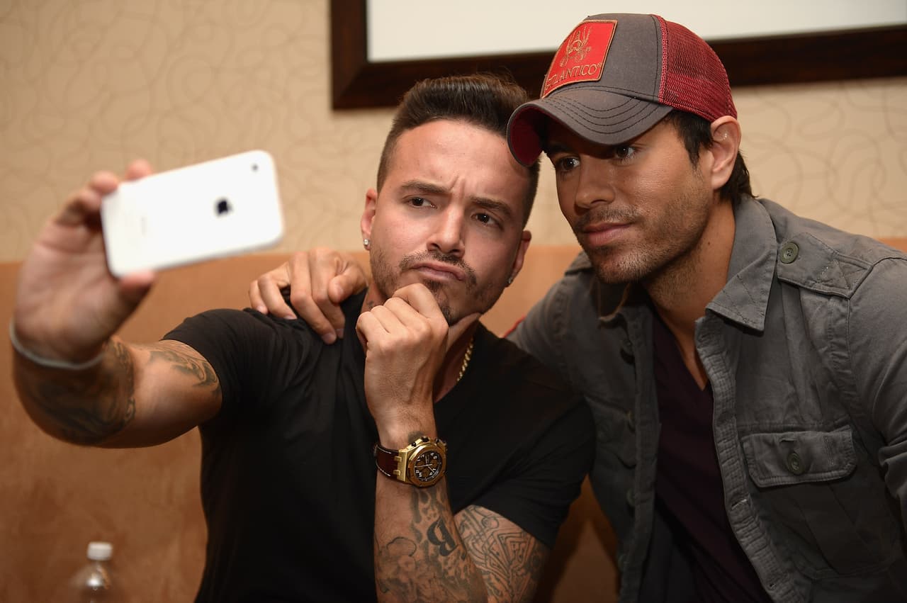 J Balvin and Enrique Iglesias take a selfie at the 'Enrique Iglesias & Pitbull Fall Tour' event at JW Marriott Marquis on April 23, 2014 in Miami, Florida. Balvin went on tour with Pitbull and Iglesias as an opening act.