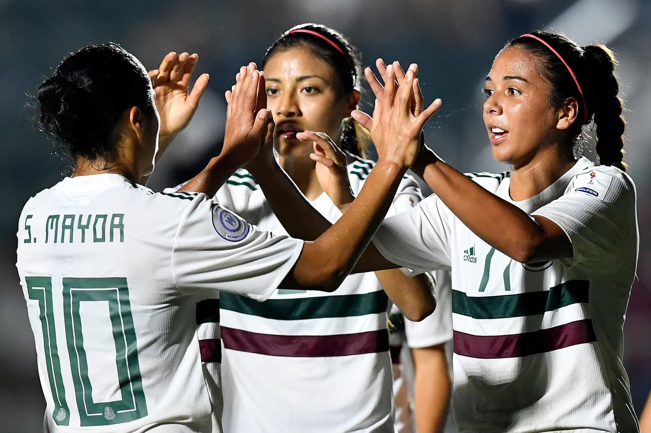 CARY, NC - OCTOBER 07: Stephany Mayor #10 and Maria Sanchez #17 of Mexico high five following a goal against Trinidad and Tobago during the soccer game at WakeMed Soccer Park on October 7, 2018 in Cary, North Carolina. (Photo by Mike Comer/Getty Images)