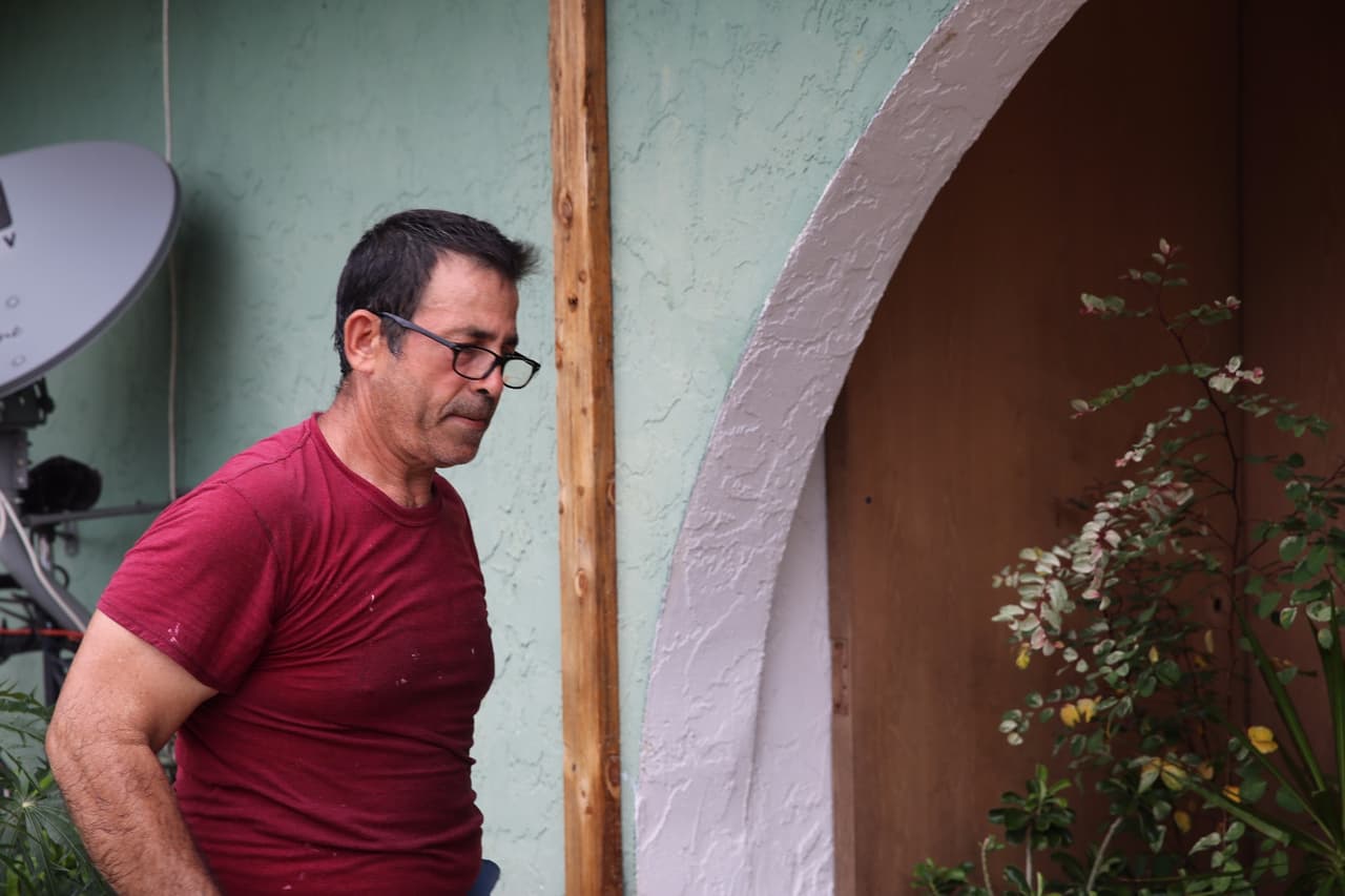 Maximiliano Garciga in Golden Gate, a largely Hispanic barrio in Naples. His wife and daughter left for Orlando.