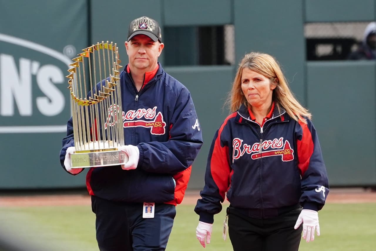 An Atlanta Braves staffer brings in the Commissioner's Trophy during a celebration at Truist Park, Friday, Nov. 5, 2021, in Atlanta. The Braves beat the Houston Astros 7-0 in Game 6 on Tuesday to win their first World Series MLB baseball title in 26 years. (AP Photo/John Bazemore)