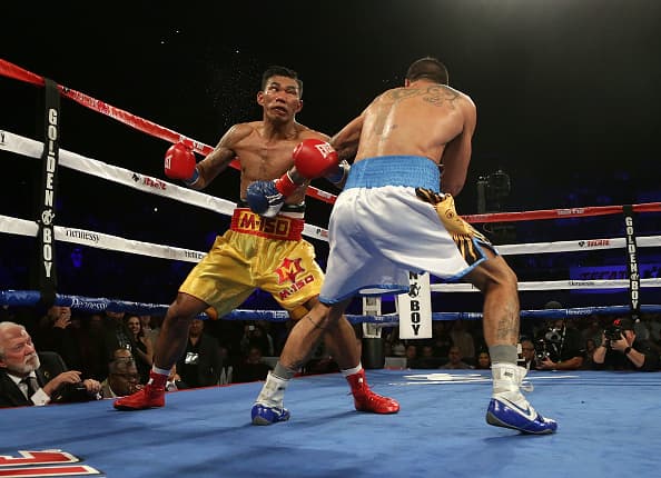 INGLEWOOD, CA - JANUARY 27: Tewa Kiram (L) of Thailand is knocked out by Lucas Matthysse of Argentina during their bout at The Forum on January 27, 2018 in Inglewood, California. (Photo by Jeff Gross/Getty Images)