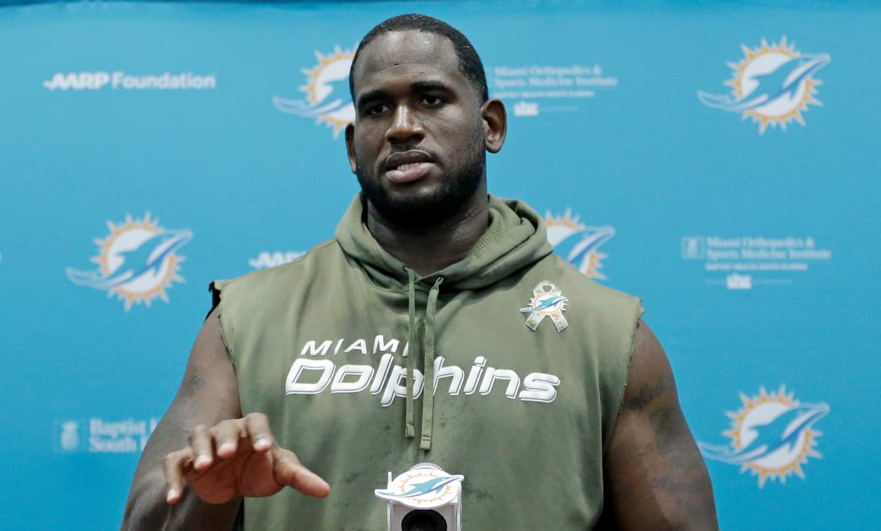 Miami Dolphins tackle Branden Albert talks to reporters during a player media availability after NFL football practice, Tuesday, May 31, 2016, in Davie, Fla. (AP Photo/Alan Diaz)